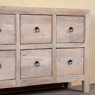 Close up image of a reclaimed sandblasted wooden chest of drawers with 10 drawers, part of our Ibiza style furniture collection.