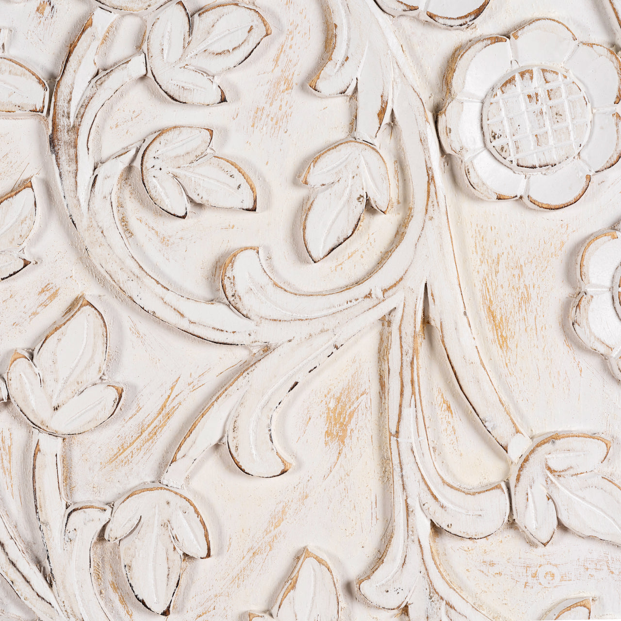 Close up image of a white-washed hand-carved mango wood cabinet in Ibiza style, a statement piece for vintage home decor.