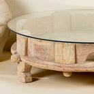 Hand-carved unique old grinder coffee table made of teak wood with additional glass top.
