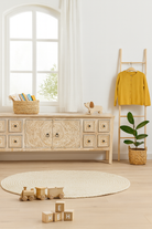 Styling idea for Ambalika whitewashed mango wood low board with hand-carved floral details, eight drawers and two compartments; ideal as a wooden low board or carved wood console table, 180 × 60 × 40 cm.