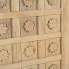 Wooden panel with floral carvings