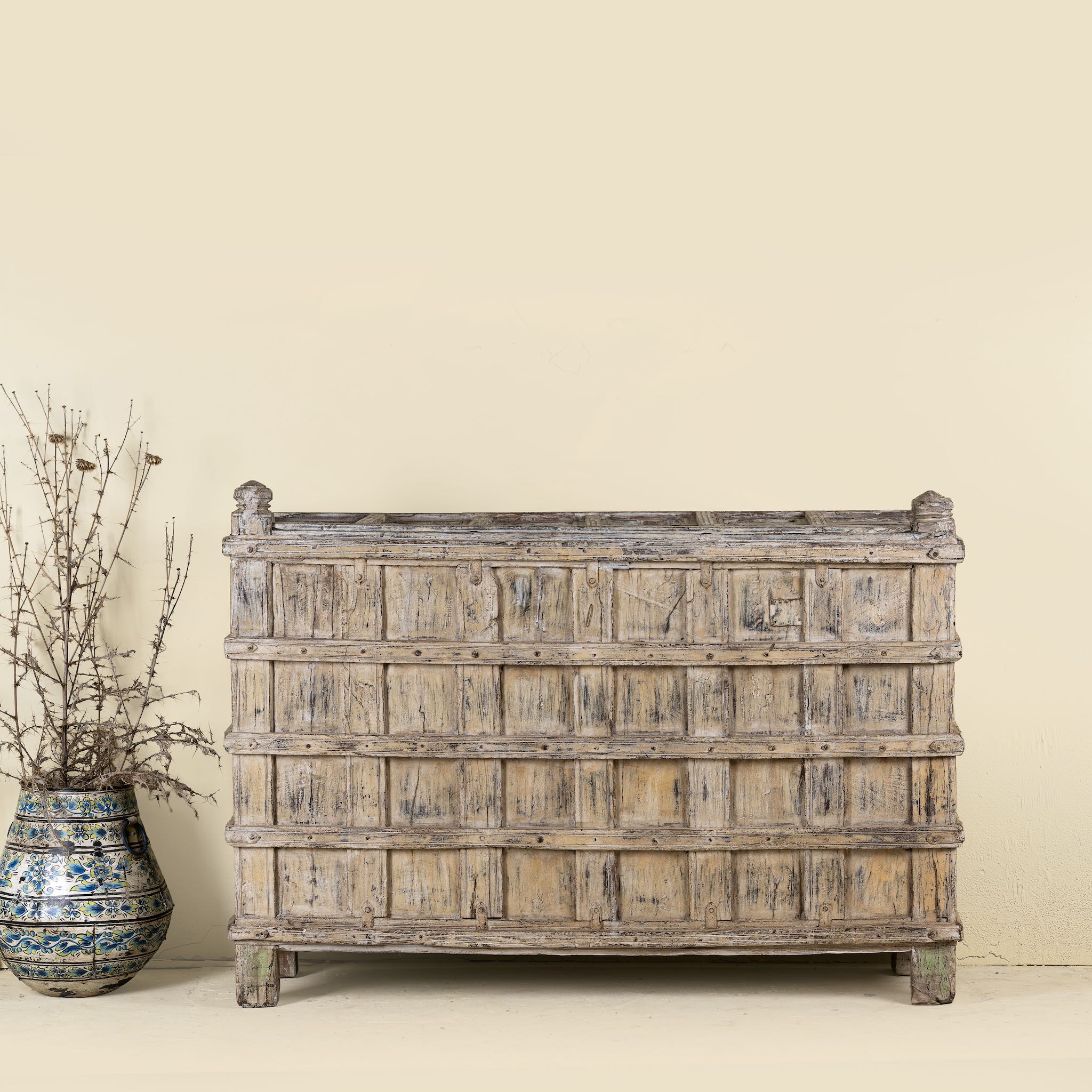 Front view of an antique console table wood counter with open shelves, a one-of-a-kind teak piece of unique furniture.