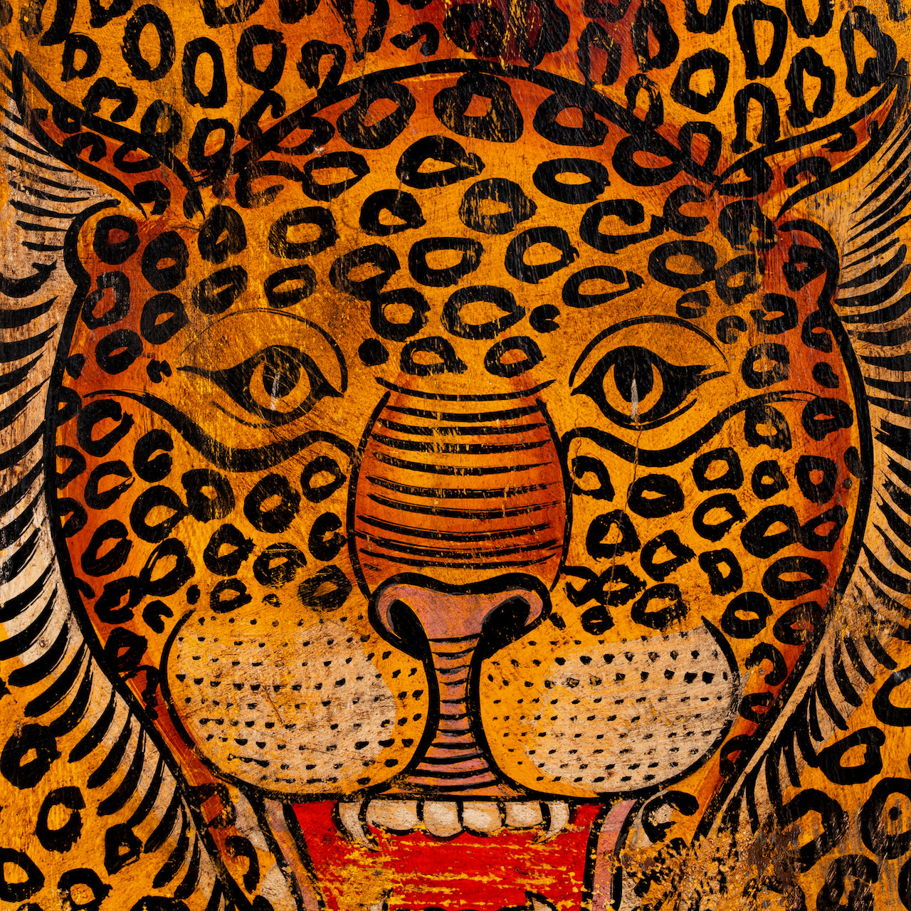 Close up image of a Arishta hand-painted wooden wall decoration featuring an Indian tiger on recycled teak—an expressive Indian door decoration with heritage and artistic depth.