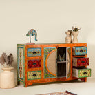 Side angle image with open drawers of a vintage style furniture sideboard with hand-painted floral motifs and rattan door inserts, bohemian rattan door furniture, 160 × 40 × 90 cm.