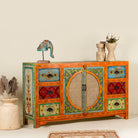 Side angle image of a vintage style furniture sideboard with hand-painted floral motifs and rattan door inserts, bohemian rattan door furniture, 160 × 40 × 90 cm.