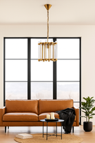 Lifestyle image of a Round antique brass iron and glass pendant light with test tube shade – minimalistic pendant light ideal for soft glass lighting in bedrooms, kitchens, or entryways.
