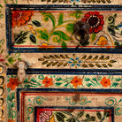 Close up image of a sustainable hand painted wooden cabinet with Mediterranean floral design, made from recycled wood, 90 × 90 × 40 cm.
