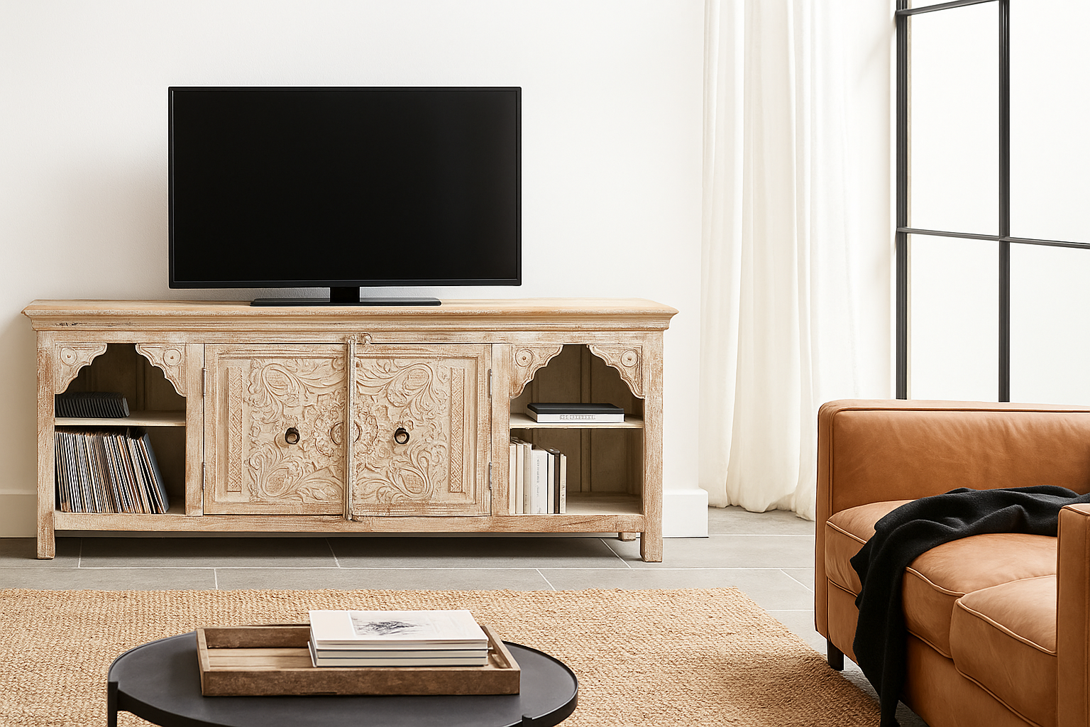 Lifestyle image of a hand-carved mango wood Mediterranean lowboard with floral engravings and whitewashed finish – carved wooden furniture combining traditional Indian craftsmanship with rustic elegance.