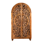 White background image of a half-round mango wood wardrobe with floral carvings, a unique example of sustainable furniture and artisanal furniture.