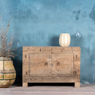 Sideboard with hand-carved teak wood front, sandblasted for a sun-worn finish — a unique piece in rustic Ibiza style with circular mandala carvings and iron ring handles.
