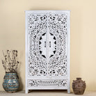 Hand-carved wooden wardrobe in white-wash finish, perfect for a boho chic living room or bedroom storage.
