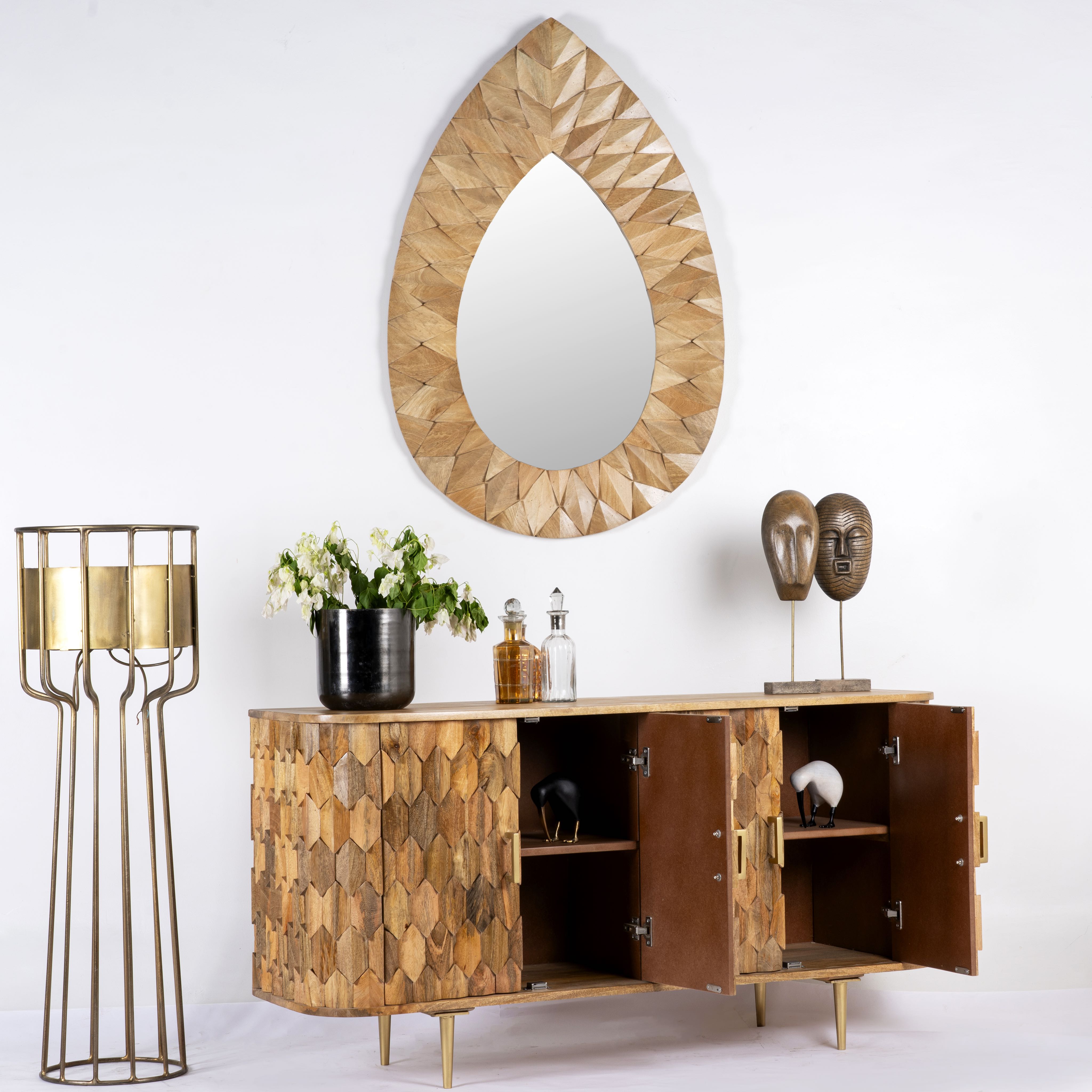 Side angle image with open door of a handcrafted mango wood sideboard with hexagonal inlay design and brass-finished legs—artisanal bedroom furniture combining craftsmanship and modern elegance.