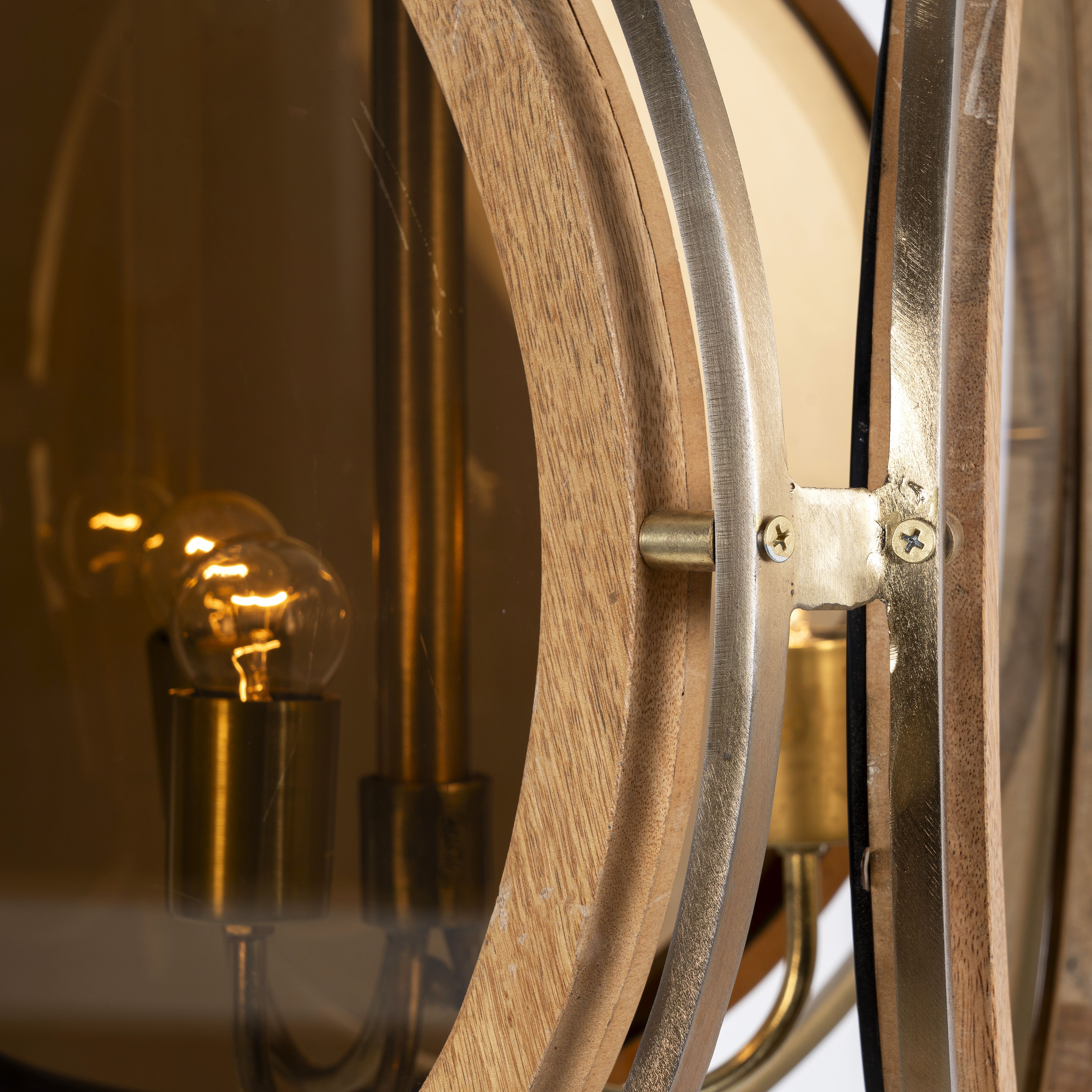 Close up image of a artsy pendant lamp with 3-circle mango wood and brass-plated design, tinted glass inserts – vintage lighting piece for dining rooms, kitchens, or stylish living areas.