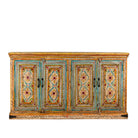 White background image of a hand-painted sideboard made from reclaimed wood, featuring four intricately detailed doors with vibrant floral and geometric motifs in soft blues, yellows, and reds, finished with a distressed vintage patina for a charming, artisanal look.
