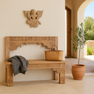 Lifestyle imagination of a hand-carved Indian deity wall sculpture with wings, made from reclaimed wood with sandblasted finish – spiritual wall decoration, 30x40x5cm.