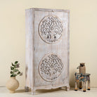 Side angle image of a hand-carved mango wood wardrobe with Tree of Life design, distressed finish, ideal for bohemian interiors, 90 × 40 × 180 cm.