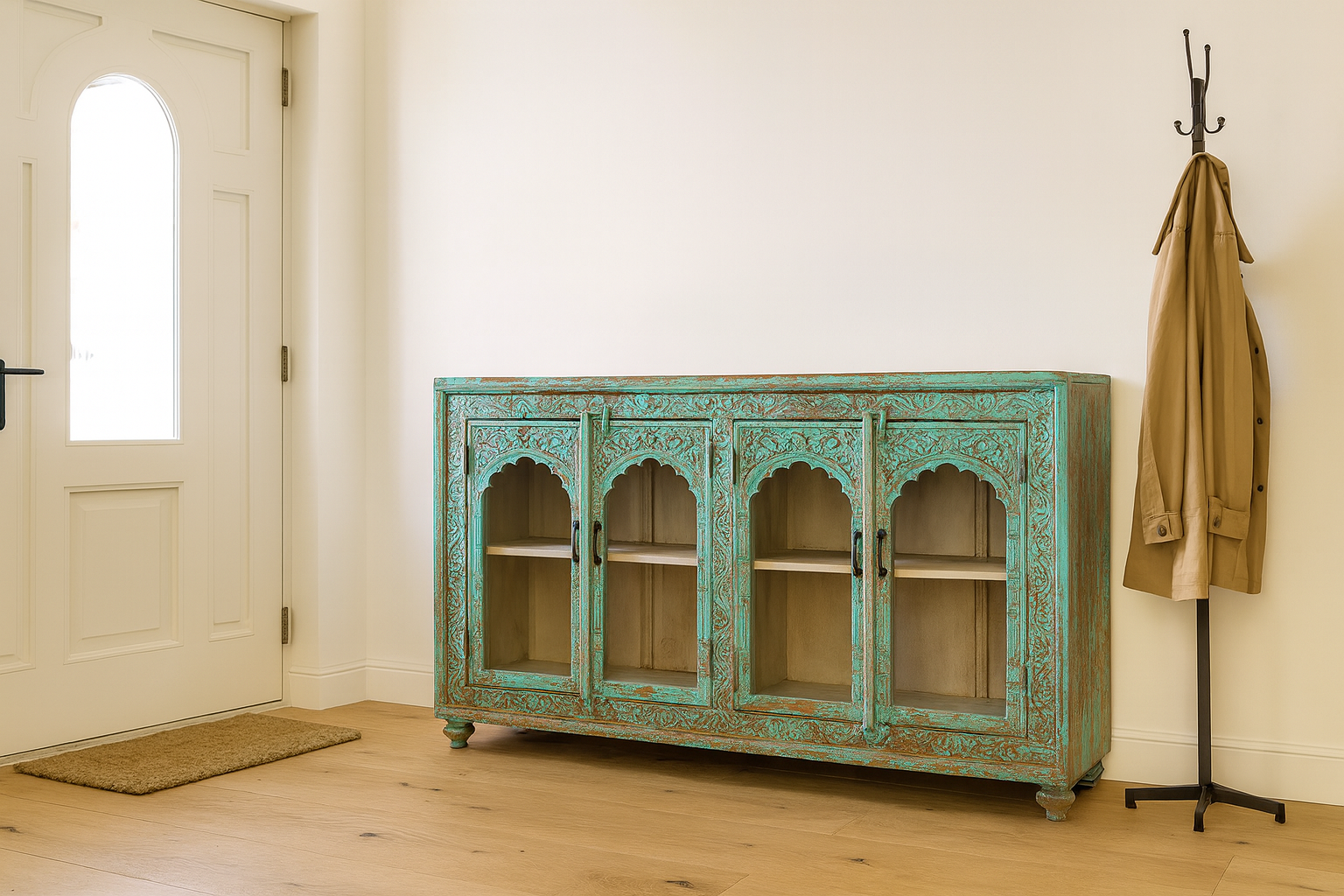 Lifestle image of a handcrafted turquoise-washed carved wooden sideboard with Indian motifs and open compartments; ideal as living room furniture or carved showcase, 180 × 100 × 40 cm.