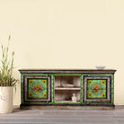 Hand-painted reclaimed wood vintage lowboard with floral motifs – a colourful piece of sustainable furniture for artistic and rustic interiors.