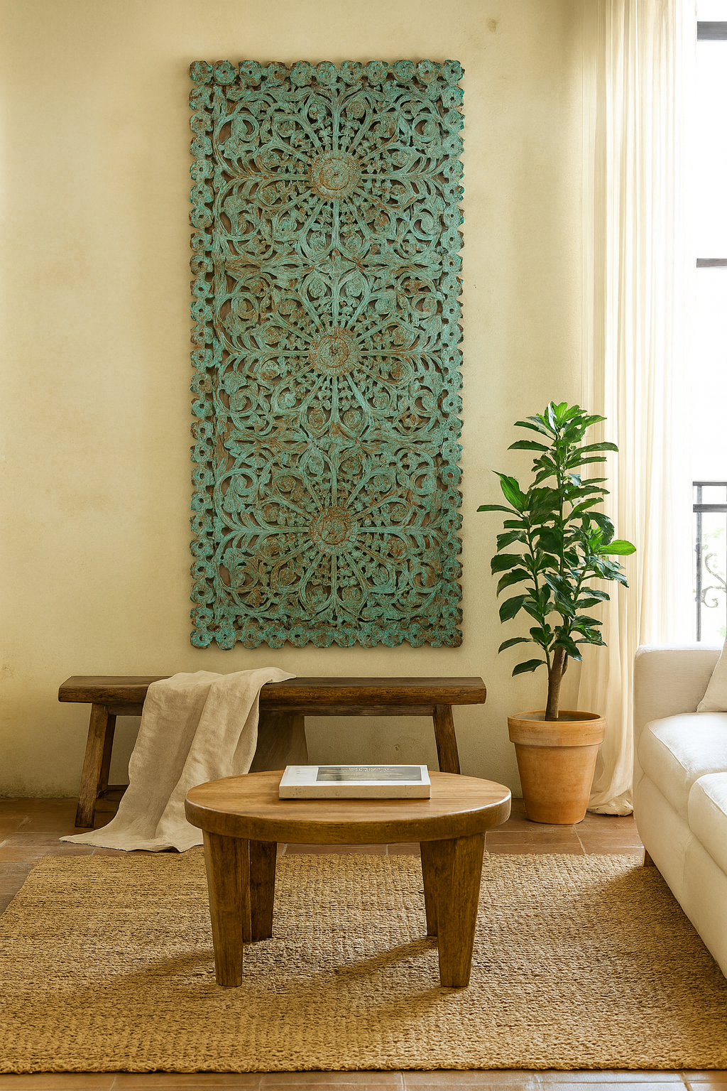 Lifestyle scene with a hand-carved mango wood wall panel with floral motifs in blue finish – Kataee Blue model by Om Home & Garden