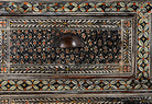 Close up image of a hand-painted Indian chest of drawers made from recycled wood – unique furniture featuring colourful motifs and antique craftsmanship.