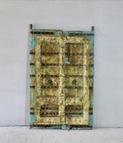 Antique Indian teak and iron door with distressed turquoise and ochre patina, rustic vintage wall panels and bold vintage home decor.