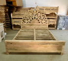 Manufacturing image of a hand-carved wooden bed frame in mango wood featuring an intricate lotus flower design – Lotus bed 180x200 cm by Om Home & Garden