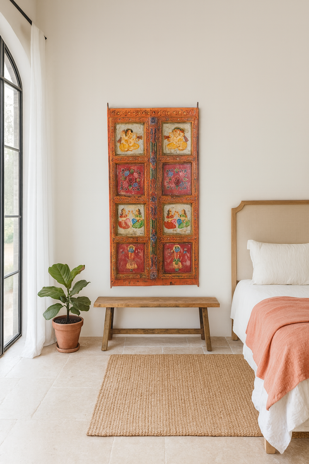 Lifestyle image of a hand-painted Indian antique teak wood door with mythological and folk motifs, vibrant orange frame, vintage wall panels for spiritual and artistic home decor.
