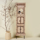 Mirror stand crafted from reclaimed teak wood with intricate carved detailing and two storage cabinets, set on a sturdy iron base, blending rustic charm with vintage Indian architectural elements.
