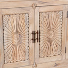 Close up image of a hand-carved mango wood sideboard with sandblasted finish – a rustic mango wood furniture piece ideal for Ibiza style interiors.
