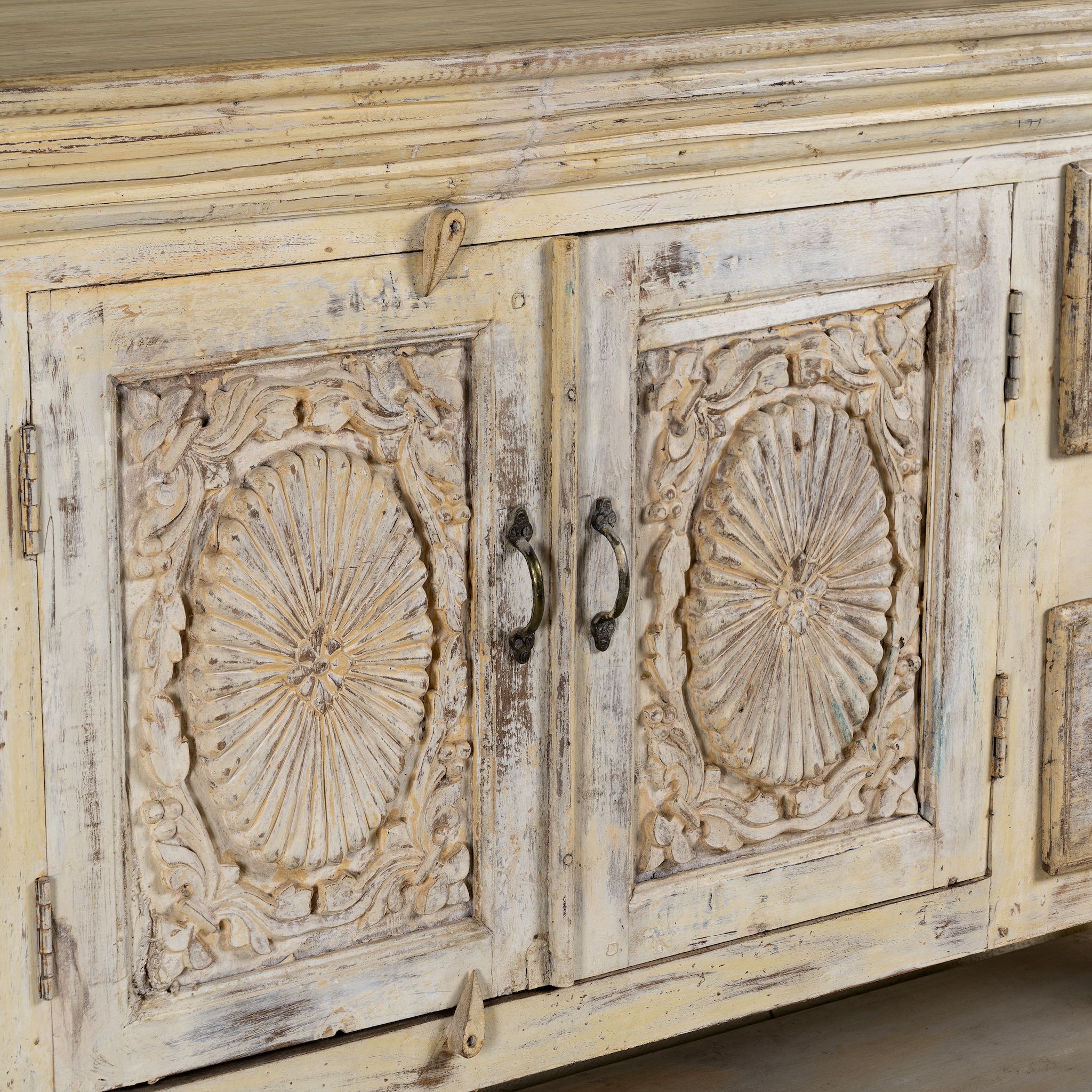 Close up image of a antique console table wood with carved teak front, part of our teakwood tables collection.