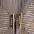 Detail view of Sahishnu sideboard showing hand-carved linear engravings and wood texture