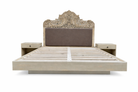 White background image of a hand-carved vintage bed Samar made from distressed mango wood, featuring an ornate high headboard with soft grey fabric upholstery. A unique blend of Indian craftsmanship and contemporary comfort in a natural, neutral palette.