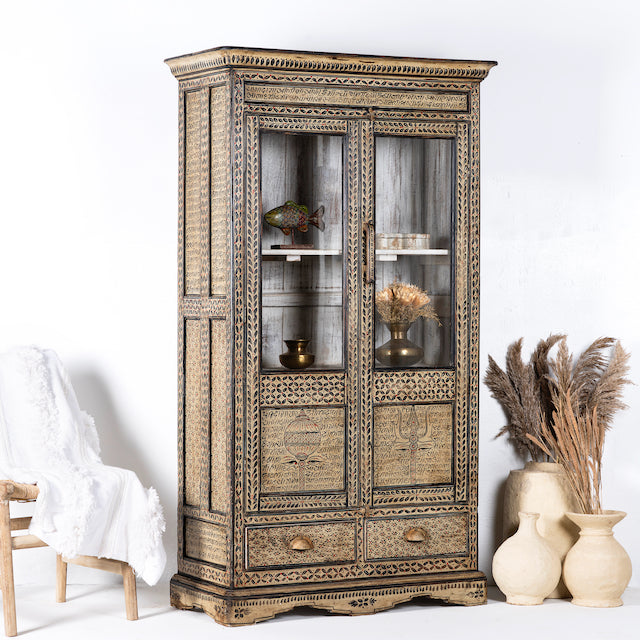 Side angle image of a hand-painted display cabinet made from recycled wood with glass doors – sustainable furniture featuring Sanskrit motifs and traditional Indian craftsmanship.