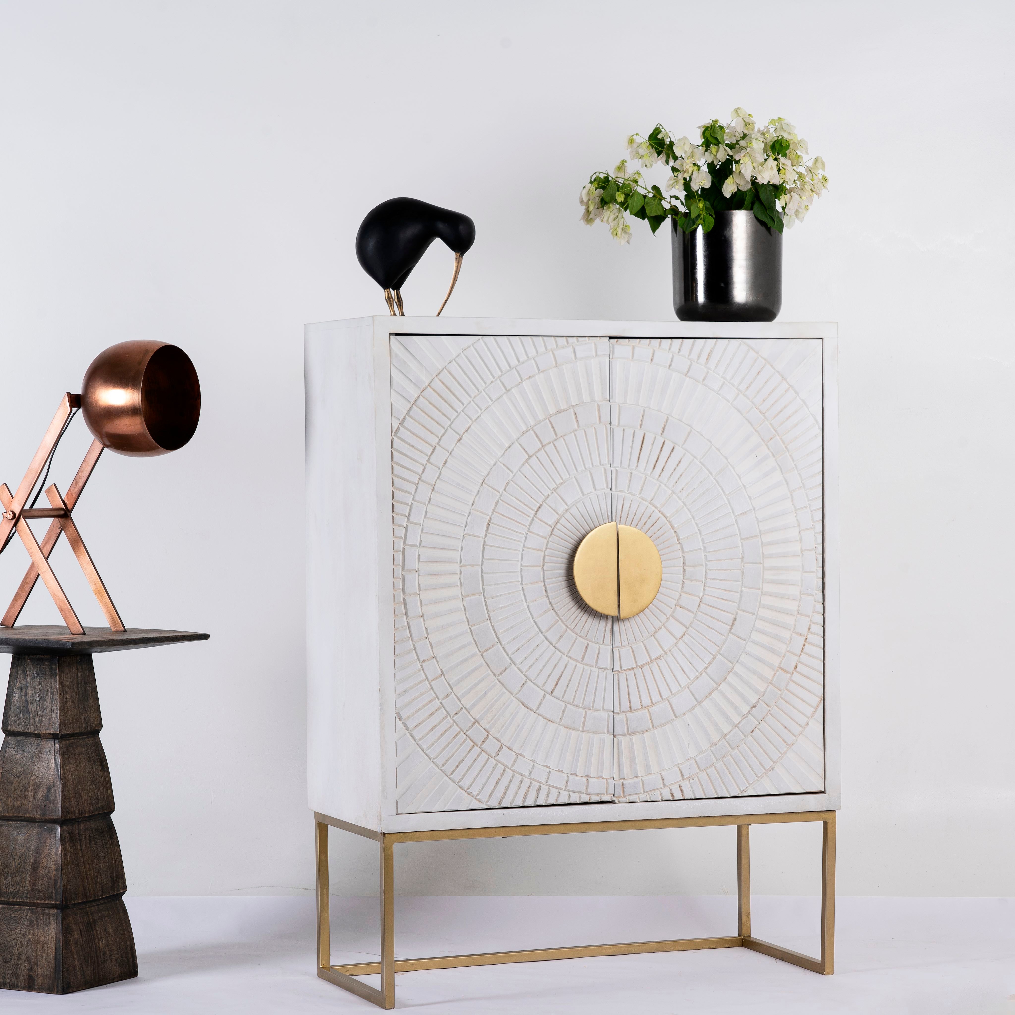 Side angle image of a whitewashed mango wood buffet with carved lines and antique brass iron base, 90 × 120 × 42 cm.