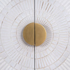 Close up image of a whitewashed mango wood buffet with carved lines and antique brass iron base, 90 × 120 × 42 cm.