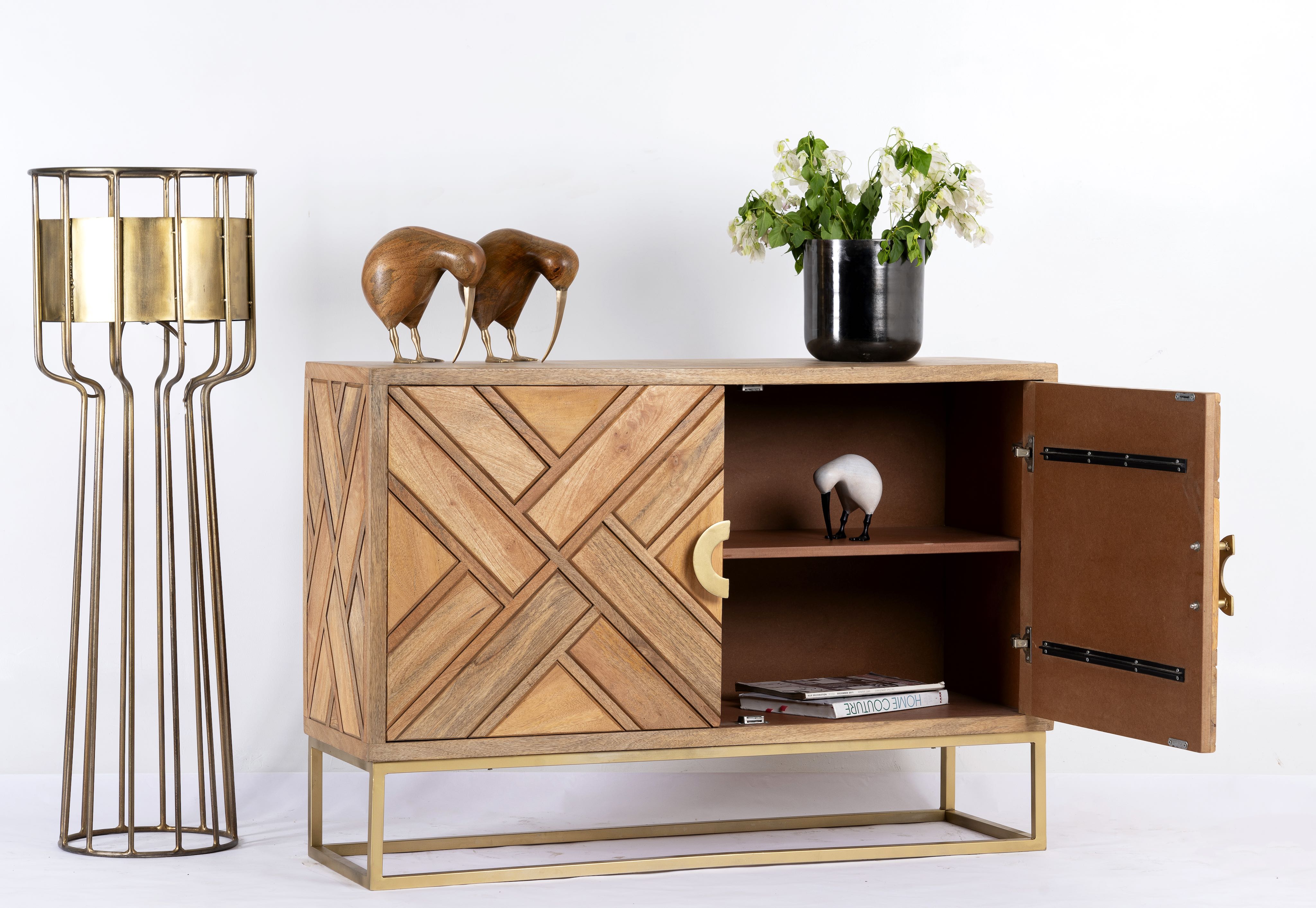 Side angle image with open door of a handcrafted mango wood sideboard with tiled front design, brass stand, and handles—minimalistic style furniture blending natural warmth with refined elegance.