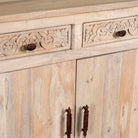 Closed up image of a hand-carved mango wood sideboard with sandblasted finish – a rustic mango wood furniture piece ideal for Ibiza style interiors.