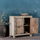 Open door view view of a unique old Door cupboard finely hand carved in bleached teak wood, driftwood design with iron fittings.