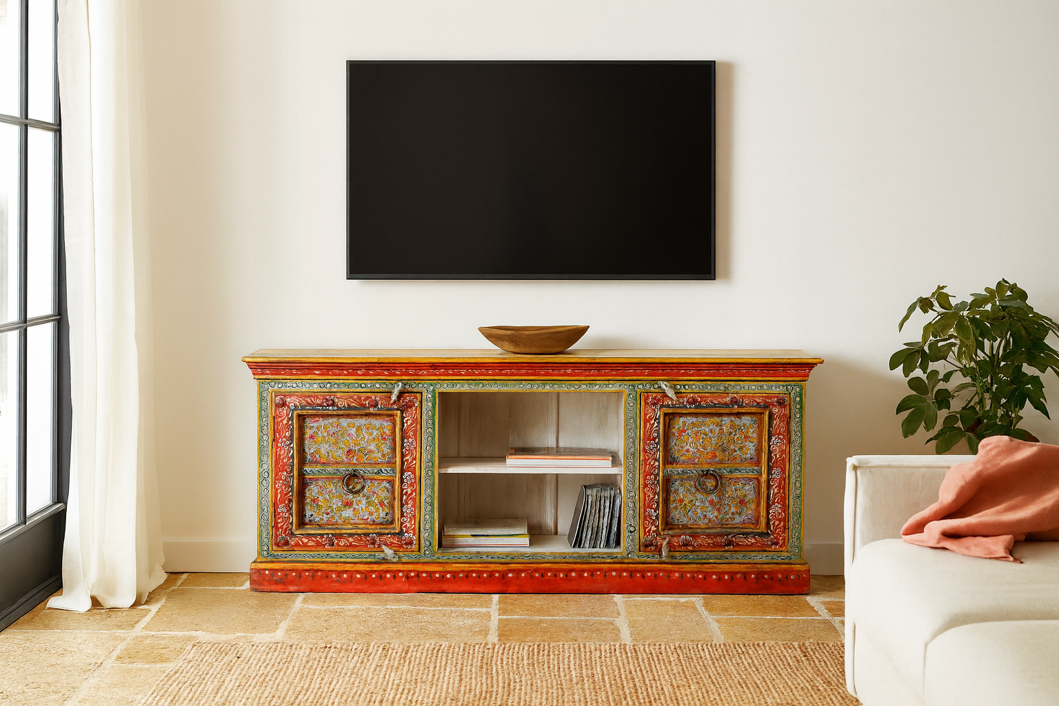 Lifestyle scene with a hand-painted reclaimed wood vintage lowboard with floral motifs – a colourful piece of sustainable furniture for artistic and rustic interiors.