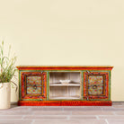 Hand-painted reclaimed wood vintage lowboard with floral motifs – a colourful piece of sustainable furniture for artistic and rustic interiors.