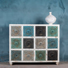 Hand-carved chest of drawers Tanika, solid mango wood with multicolour floral motifs, eclectic bohemian vintage design, 124 × 40 × 102 cm.

