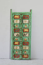 Vintage Indian antique door panel in distressed teal with hand-painted sacred and floral motifs, repurposed as wall art and vintage home decor.
