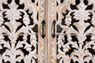 Close up image of a hand carved mango wood sideboard with whitewashed finish and intricate Indian patterns; ideal for bedroom furniture or as a hand carved sideboard, 180 × 90 × 40 cm.