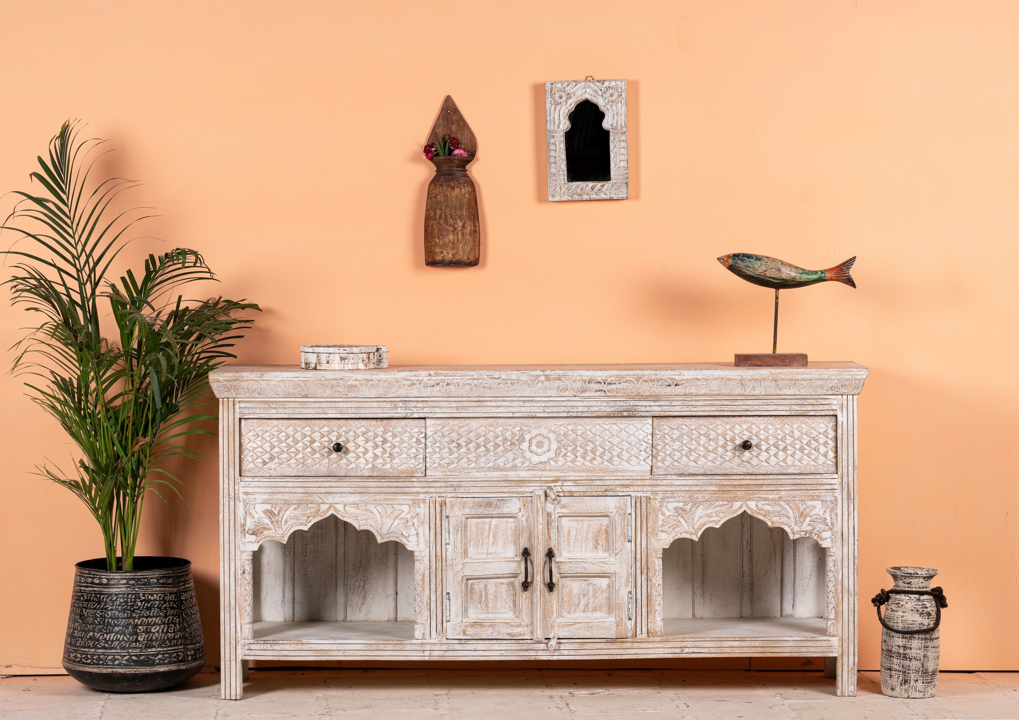 Hand-carved console table in mango wood with whitewashed finish, perfect for a bohemian interior.