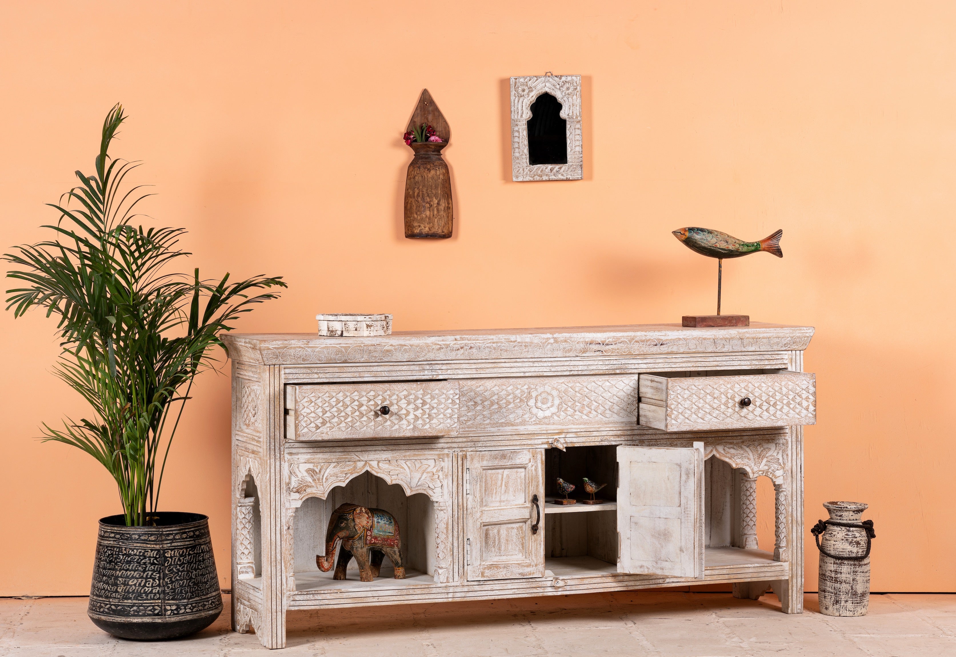 Open drawers and doors image of a hand-carved console table in mango wood with whitewashed finish, perfect for a bohemian interior.