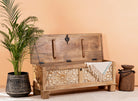 Side angle image of a hand-carved mango wood vintage chest with floral carvings – Mediterranean-style storage chest for living rooms, bedrooms, or bathrooms.