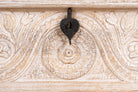 Close up image of a hand‑carved mango wood chest with floral detailing – vintage home accessories and artisan storage chest for stylish interiors.