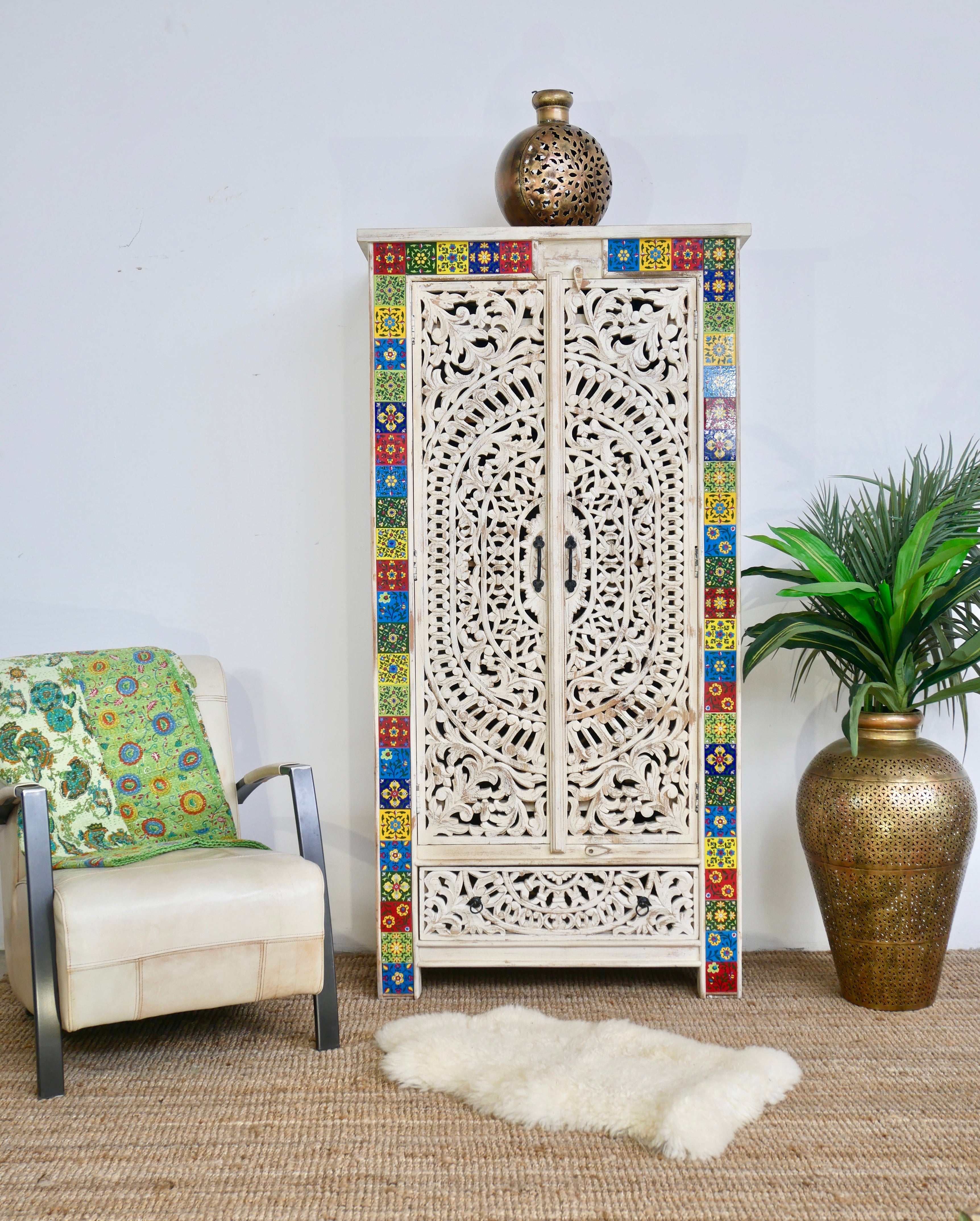 Hand-carved mango wood cabinet with white-wash finish and ceramic detailing – artisanal furniture and carved wooden furniture with Mediterranean flair.