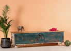 Side angle image of a mediterranean-style mango wood chest with natural finish – vintage style furniture ideal as a coffee table or TV stand with storage.