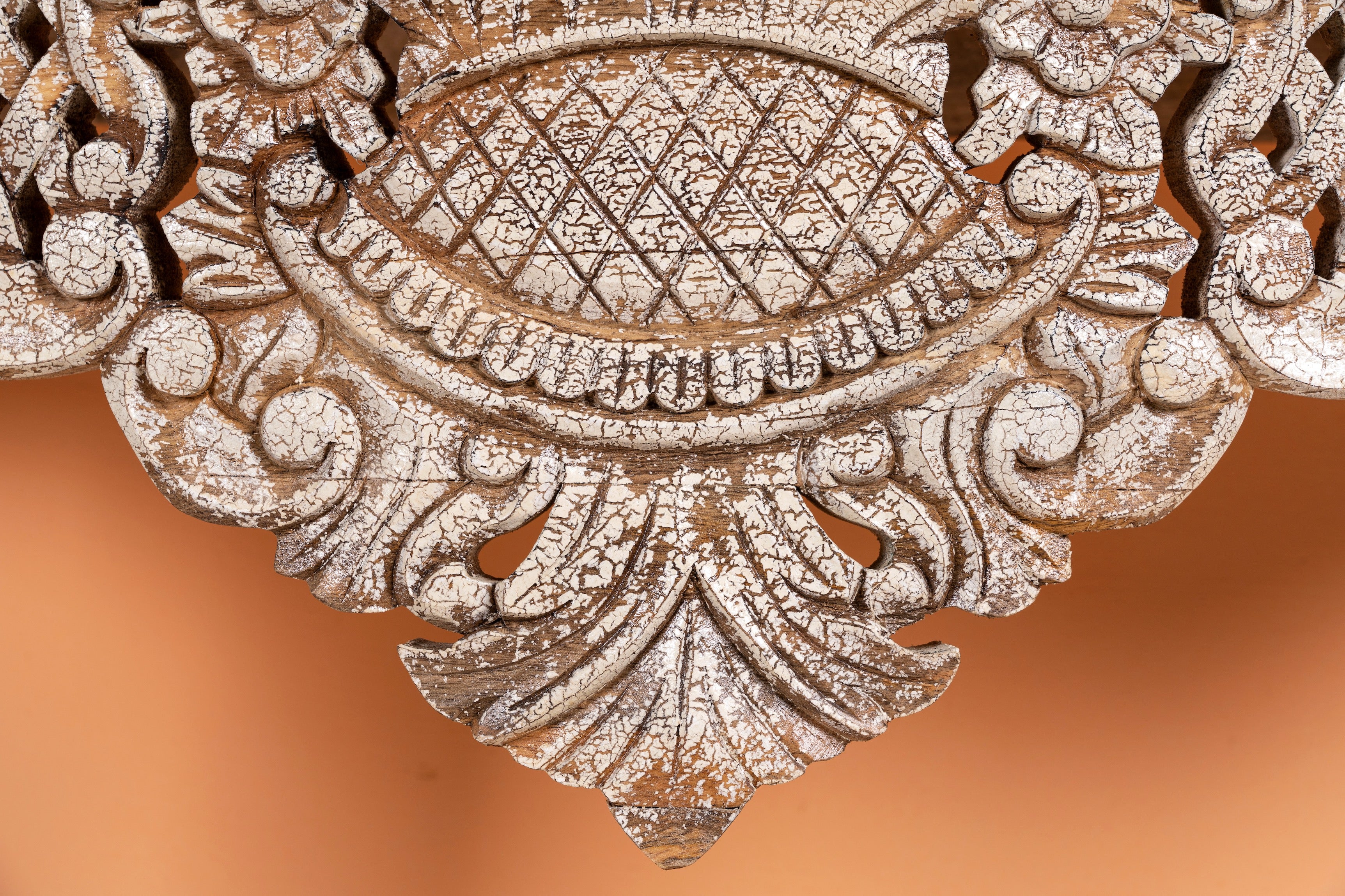 Close up image of a vintage console table in solid mango wood with hand-carved detailing; elegant lighting accent for entrance or living room, 120 × 40 × 76 cm.